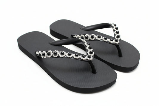 Matte black sandal with refined strap detailing